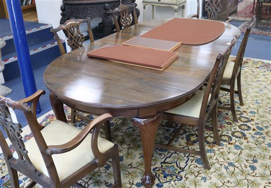 A Chippendale style circular mahogany extending dining table (three additional leaves) W.240cm